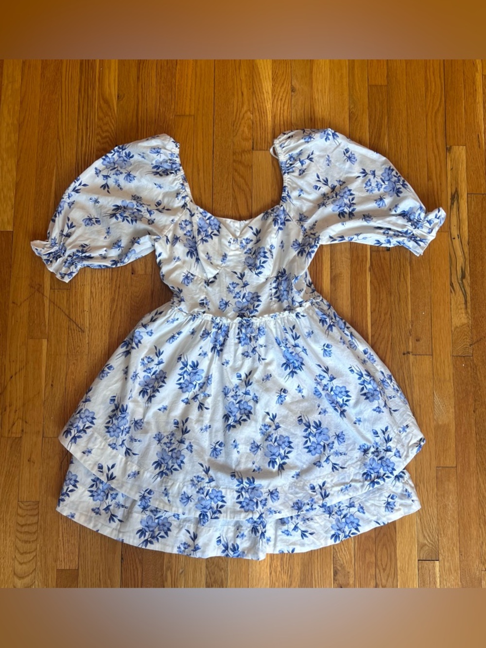 Blue floral print dress with puffy sleeves and tiered skirt